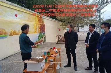  乐鱼注册美术教师到油麻二中绘制艺术墙活动